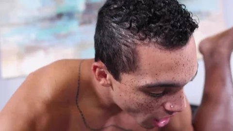 Freckled Latino tries black ass then swallows the load